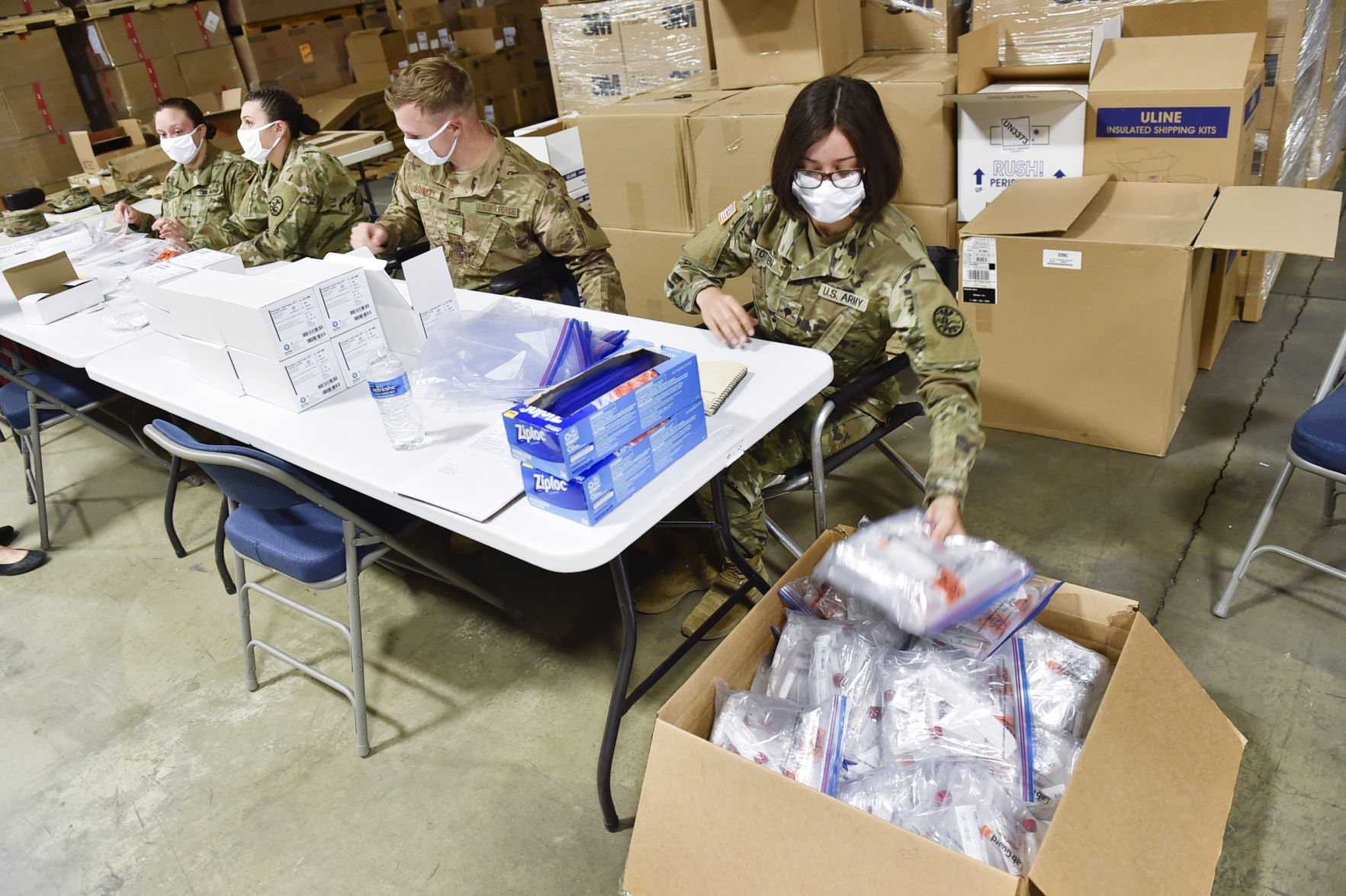 Soldiers from the Montana National Guard assemble COVID-19 testing kits